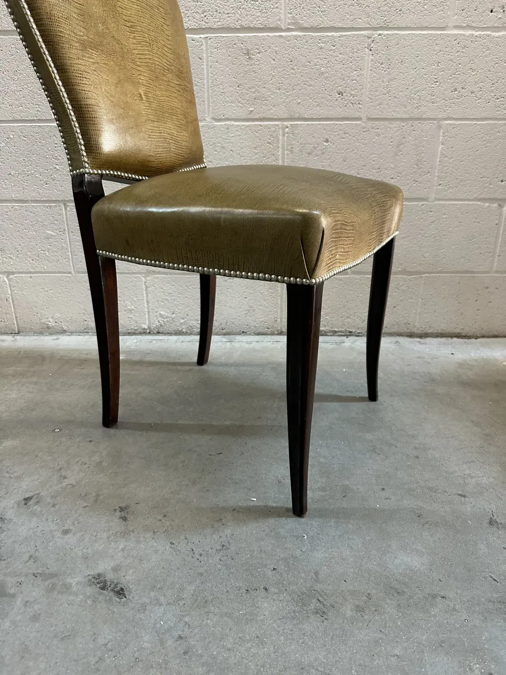 side view of 12 antique chairs, elegant upholstery and slim legs