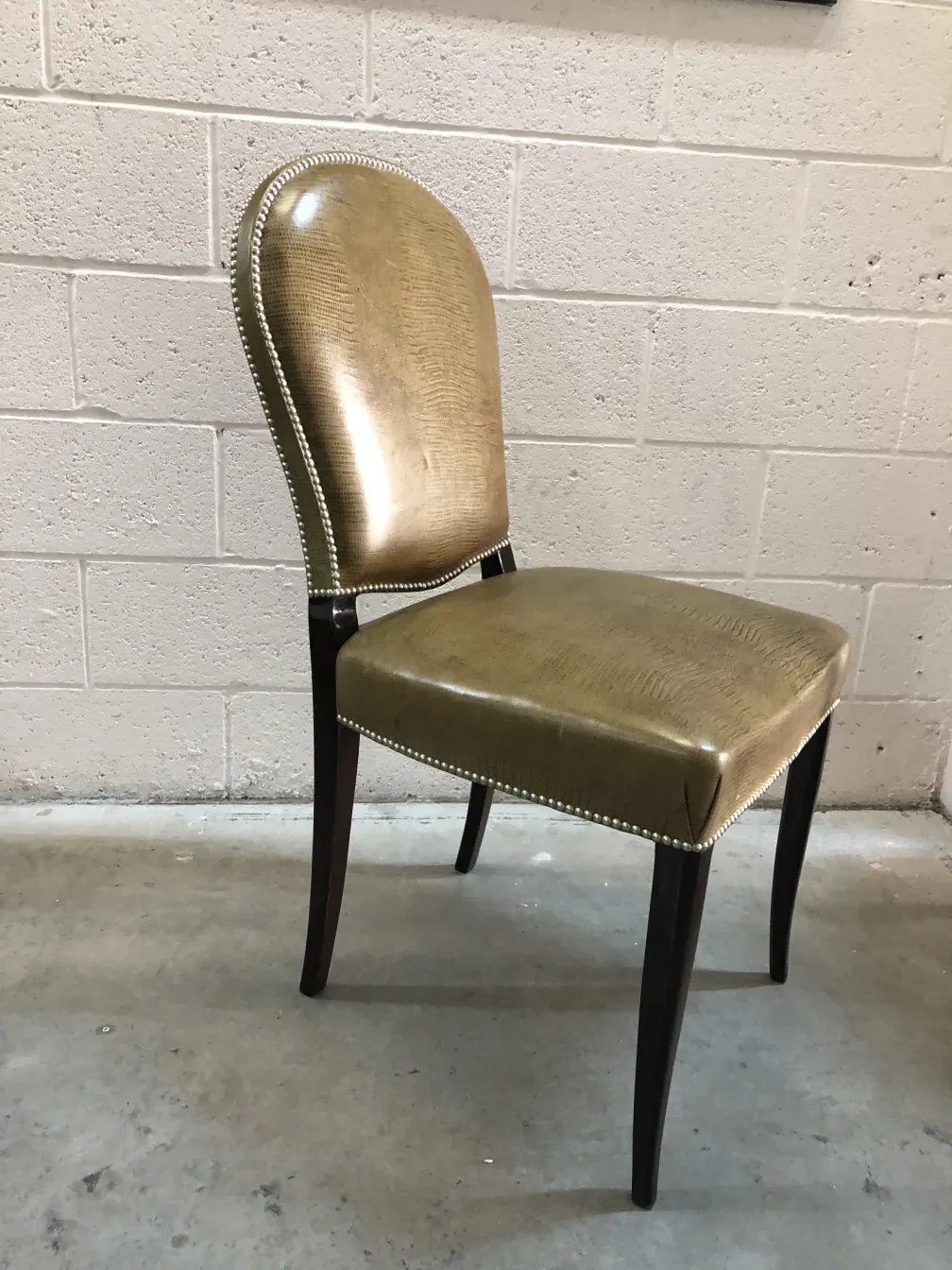 View of a pair of antique chairs in a golden color
