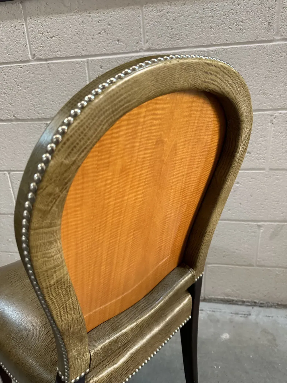 Close-up of an elegant antique chair with subtle decorations