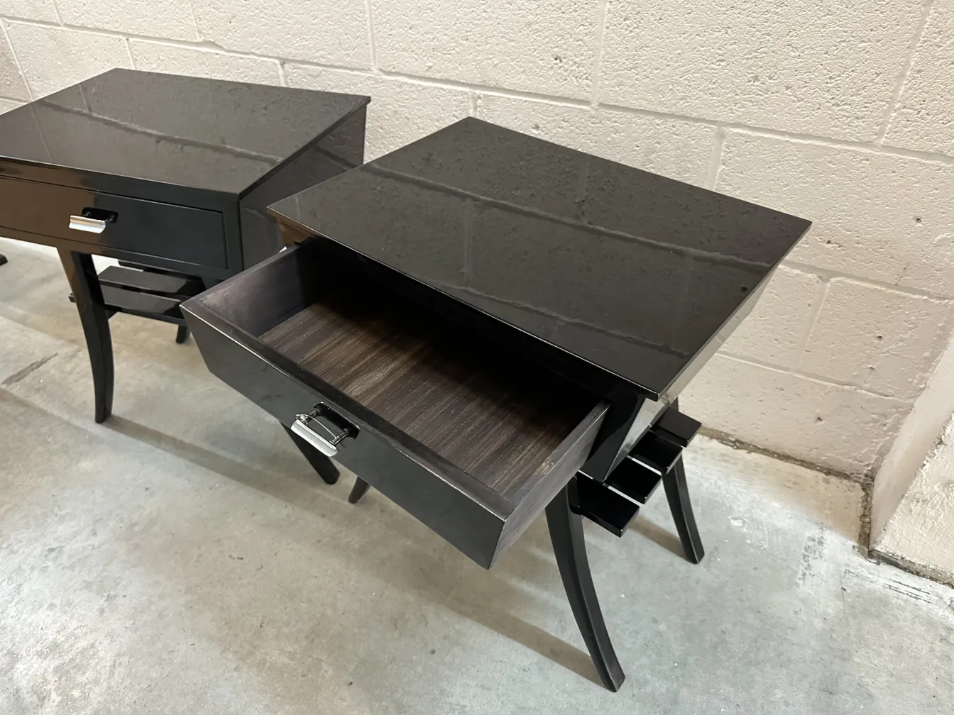 Antique bedside tables with glossy finish and elegant design in a modern setting.