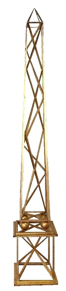 two antique obelisks in a decorative setting