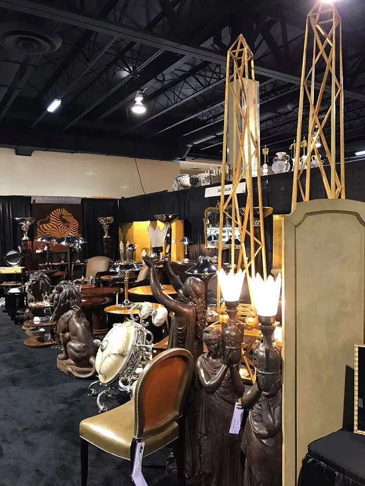 Exhibition of 2 antique obelisks surrounded by other furniture