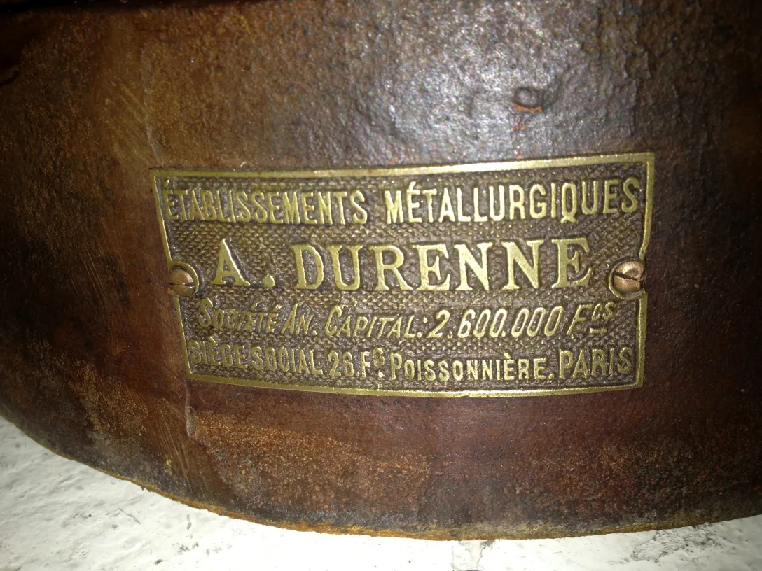 metal plaque featuring 2 lions and the name a. durenne