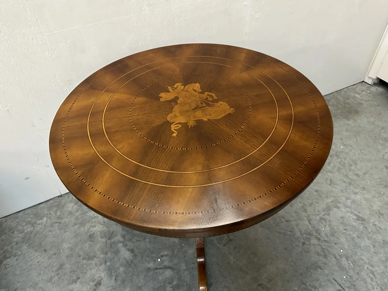 antique round table with central decoration
