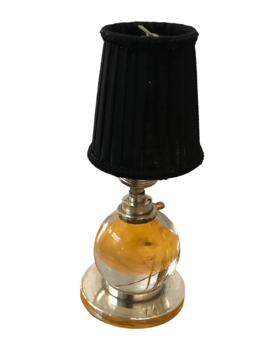 2 antique table lamps featuring black shades and a classic design.