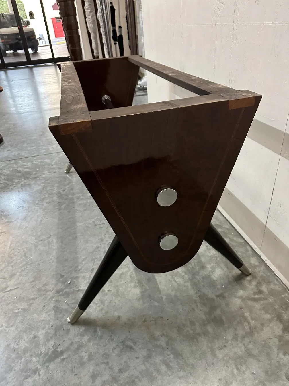 Antique dining table by Carlo Mollino for 10 people, elegant design in a cozy setting.