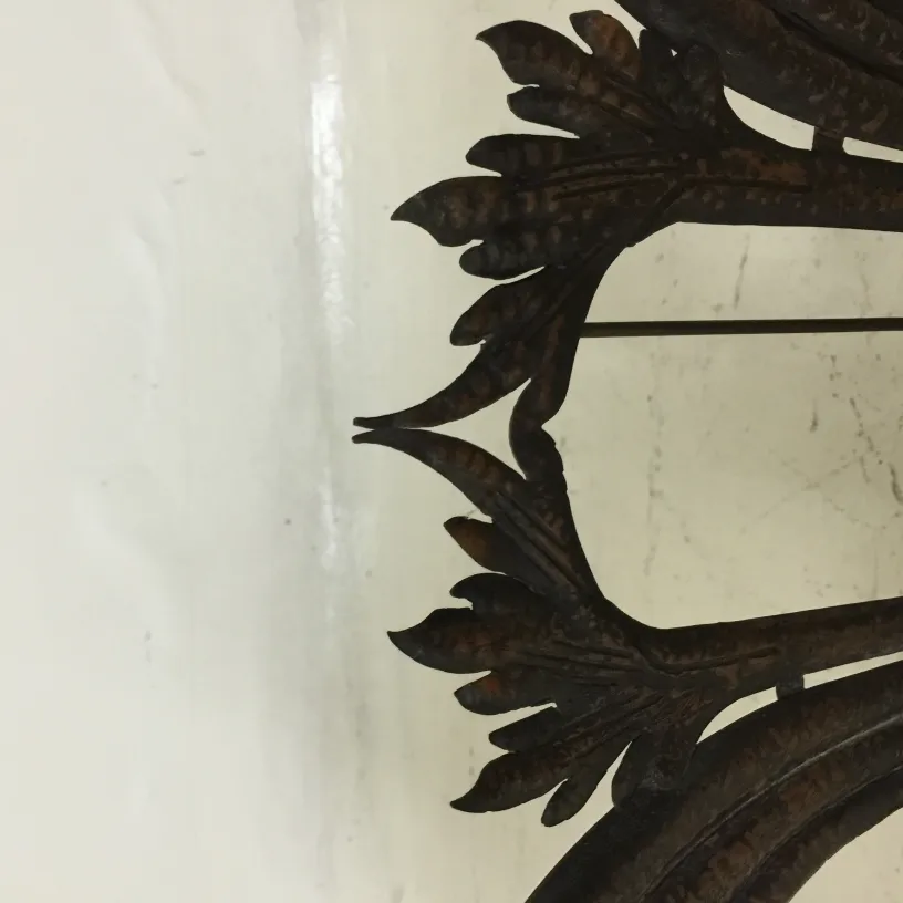 Antique picture frame with dark leaf decoration