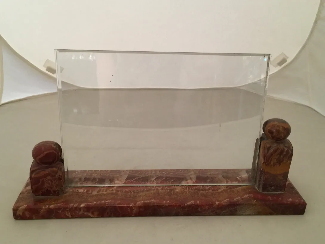 antique picture frame with decorative elements on sides