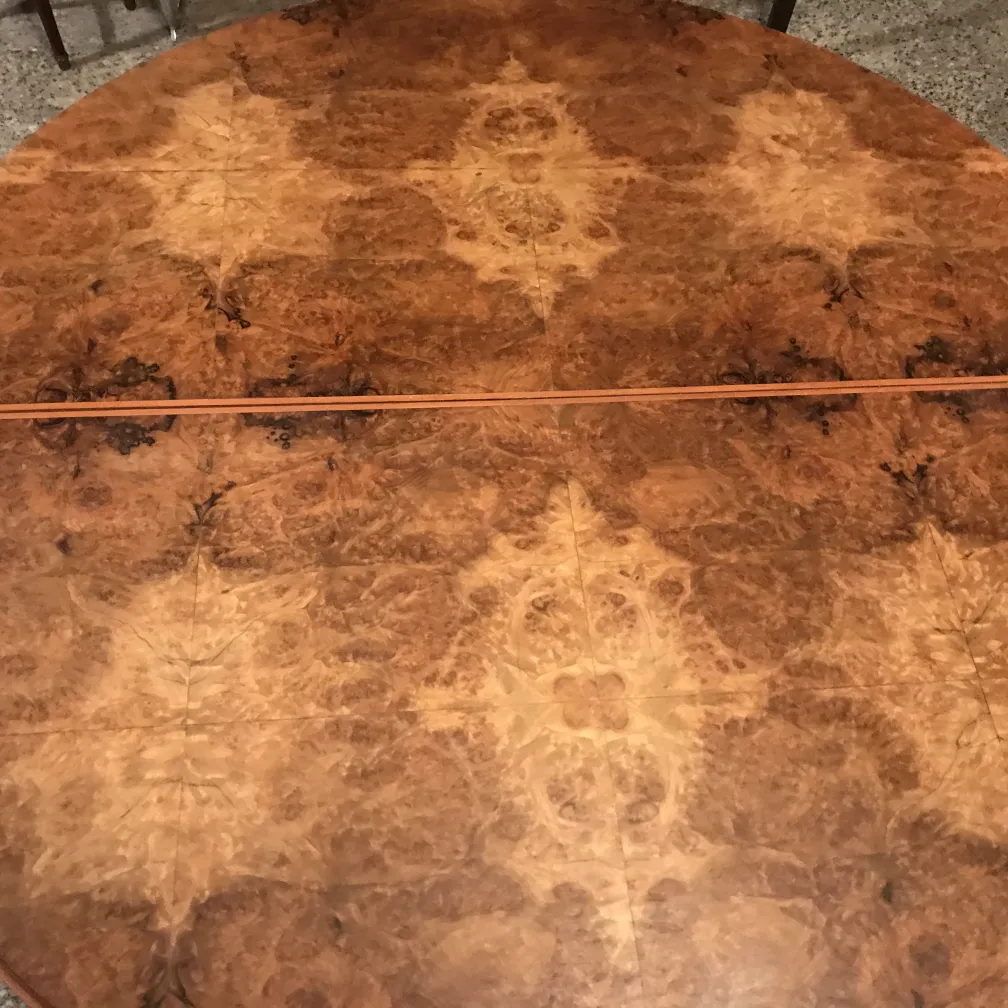 Antique dining table for four people with intricate design