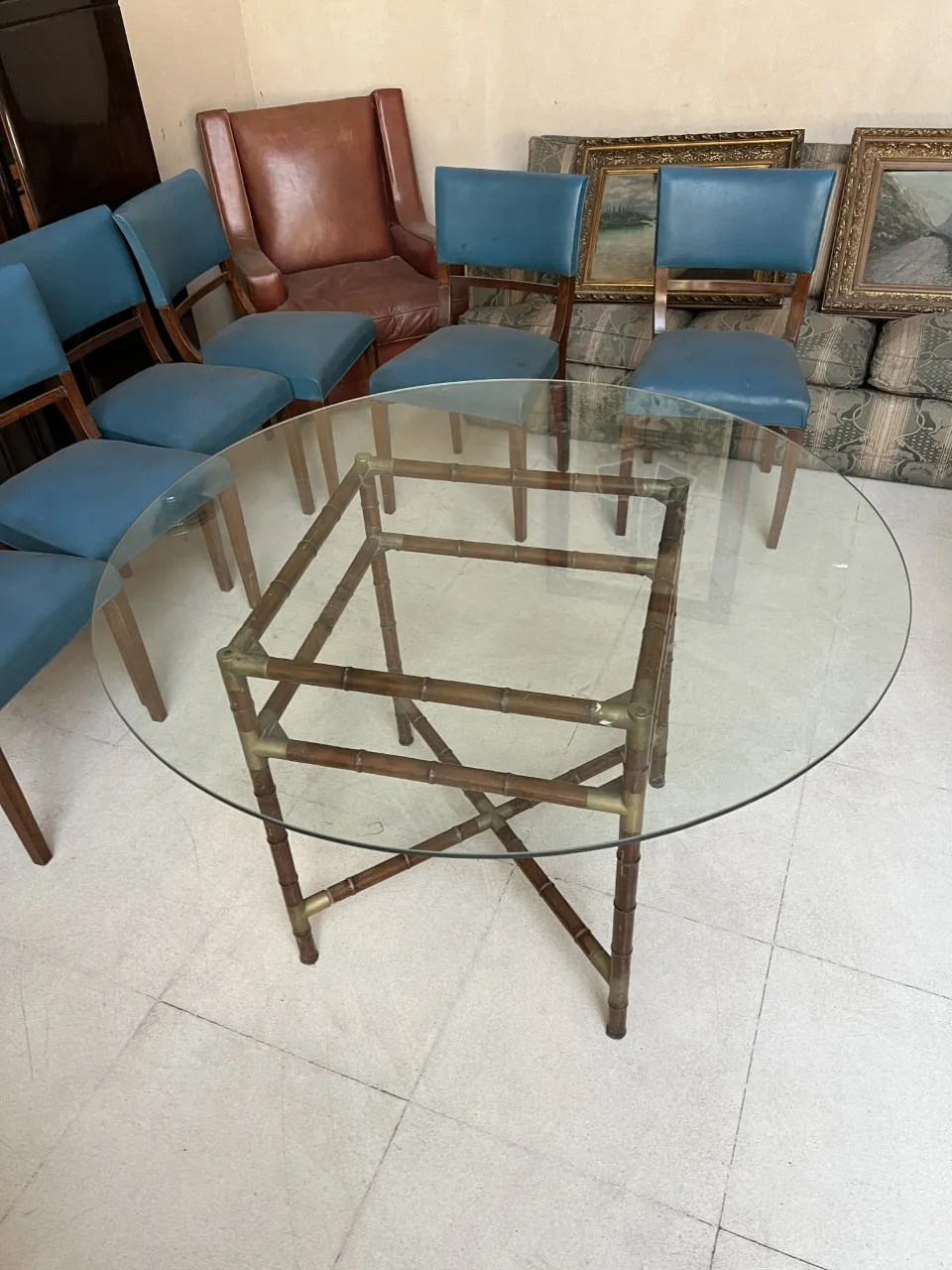 Antique dining table by William Billy Haines, seats 6 people, with blue chairs.