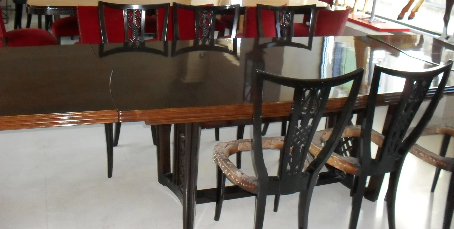 antique dining table for ten people, chairs in background