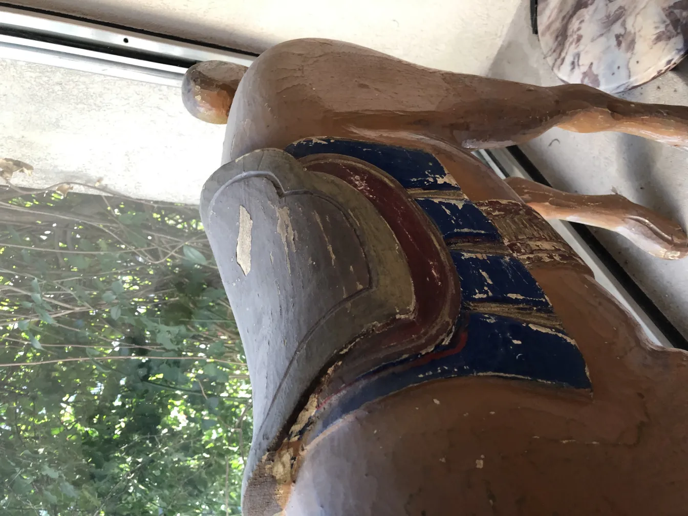 Antique llama statue with decorative details