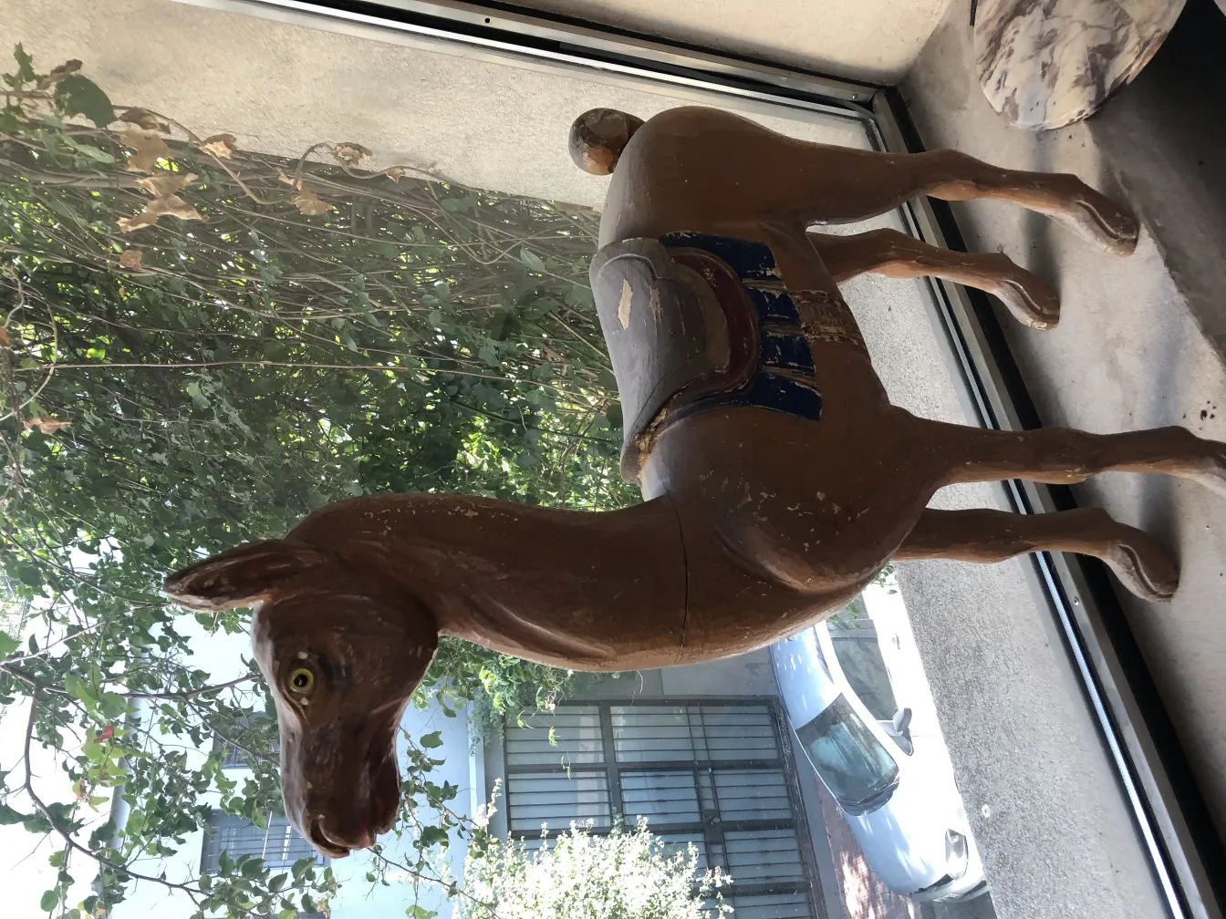 Antique decorative llama in a friendly environment.