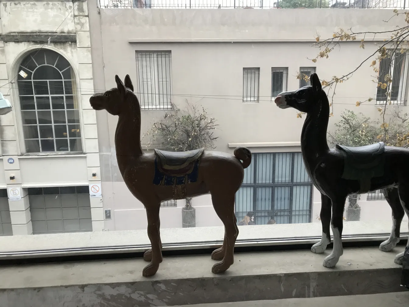 antique llama sculpture in an urban setting