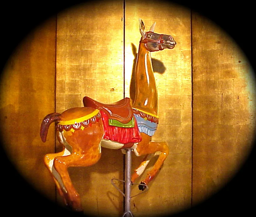 Decorative antique llama with colorful saddle