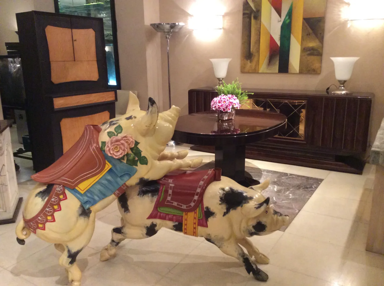 antique decorative pig sculpture with colorful details in rustic setting