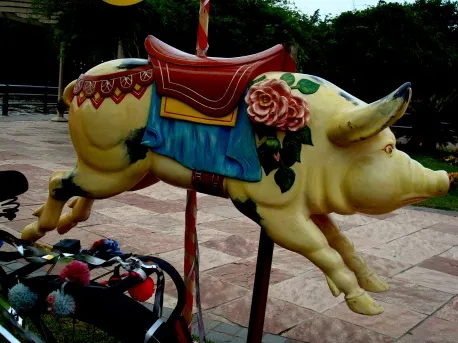 Colorful antique pig toy with floral decorations