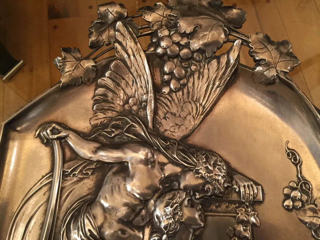 Antique wall plaques with figures and leaves