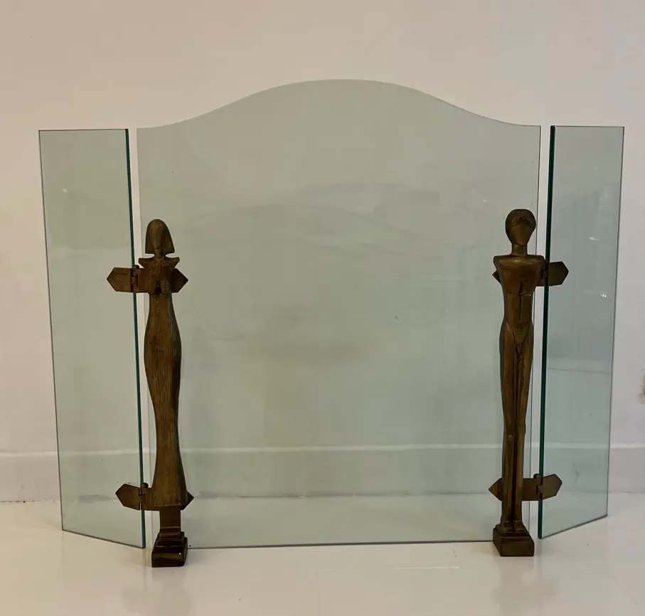 antique fireplace front with stylized figures of Alberto Giacometti