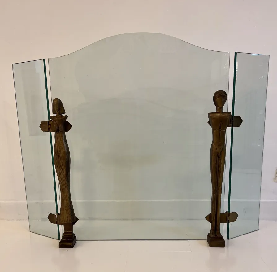 antique fireplace front with stylized figures by Alberto Giacometti