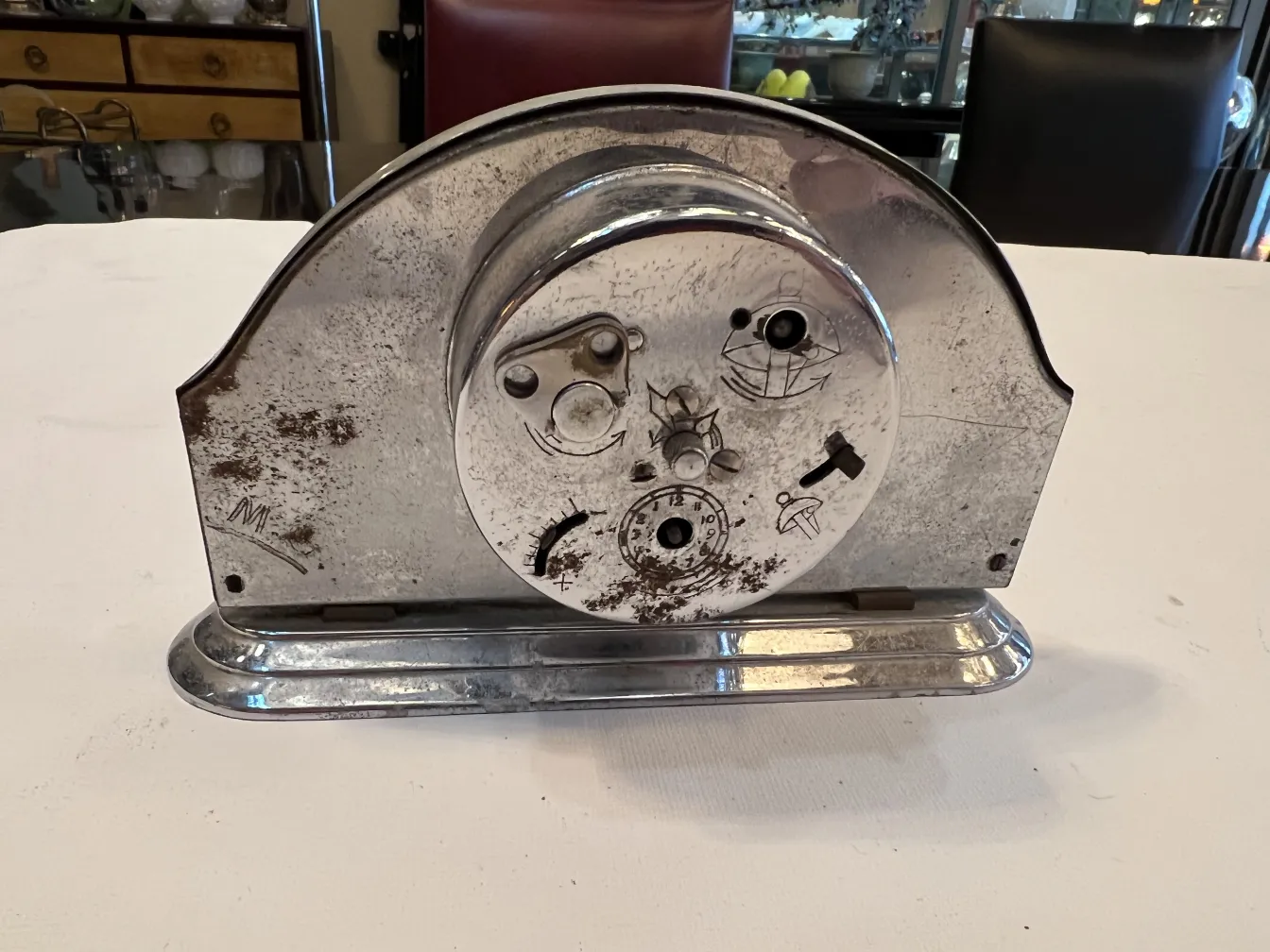 Antique table clock with distinctive features and visible wear.