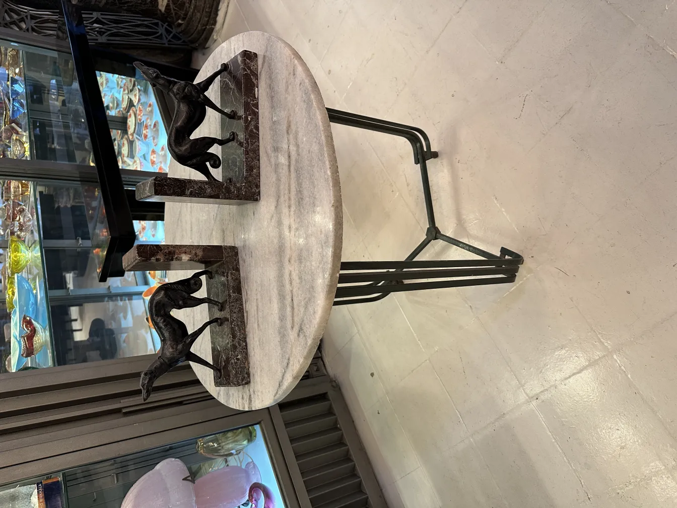 Antique bookends featuring dog sculpture in a display