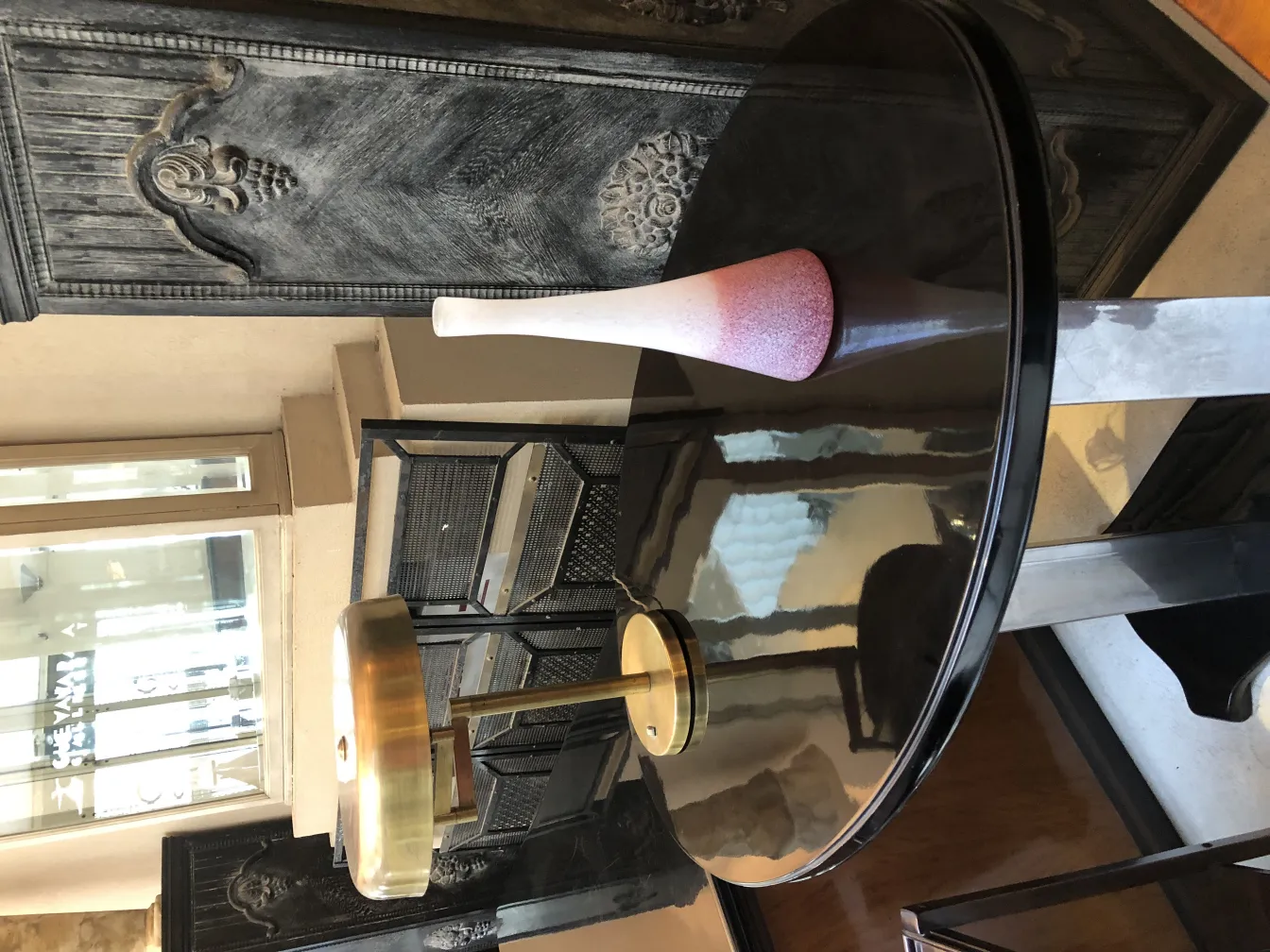 antique decorative vase with varied shades near a table