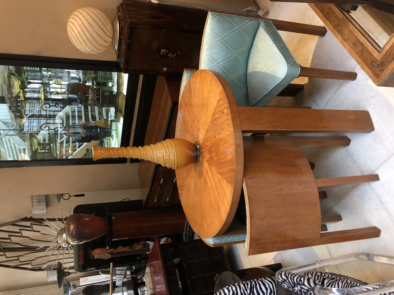 antique elongated vase on wooden table