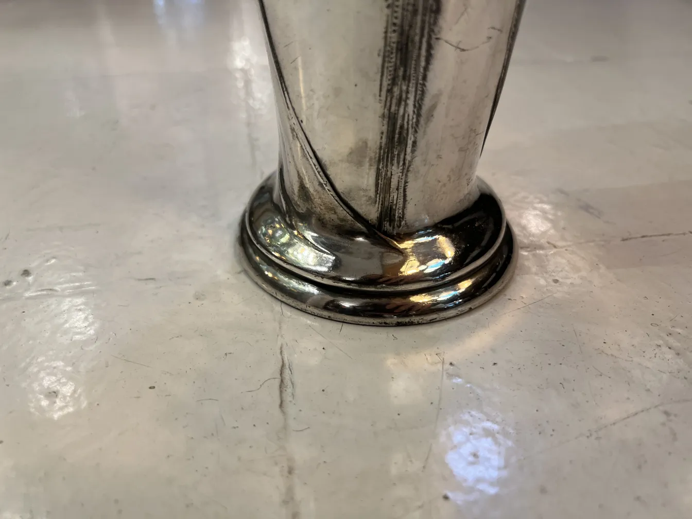 Antique vase with a sleek and shiny base