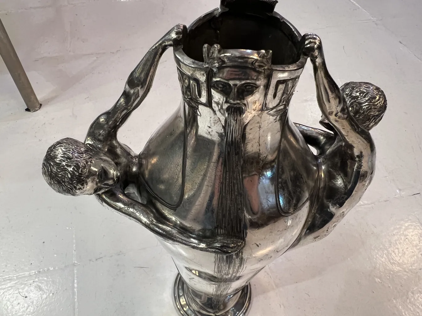 antique vase with sculptural details and figures