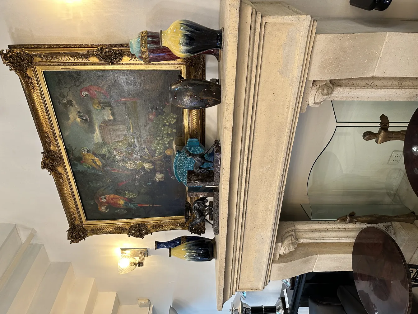 Antique decorative bookends displayed on a fireplace