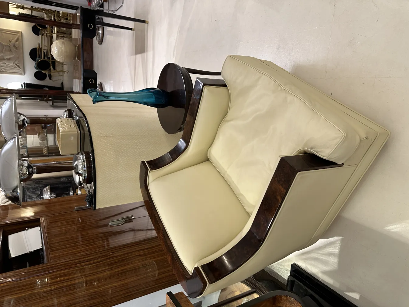 decorative antique blue vase on light table with armchair