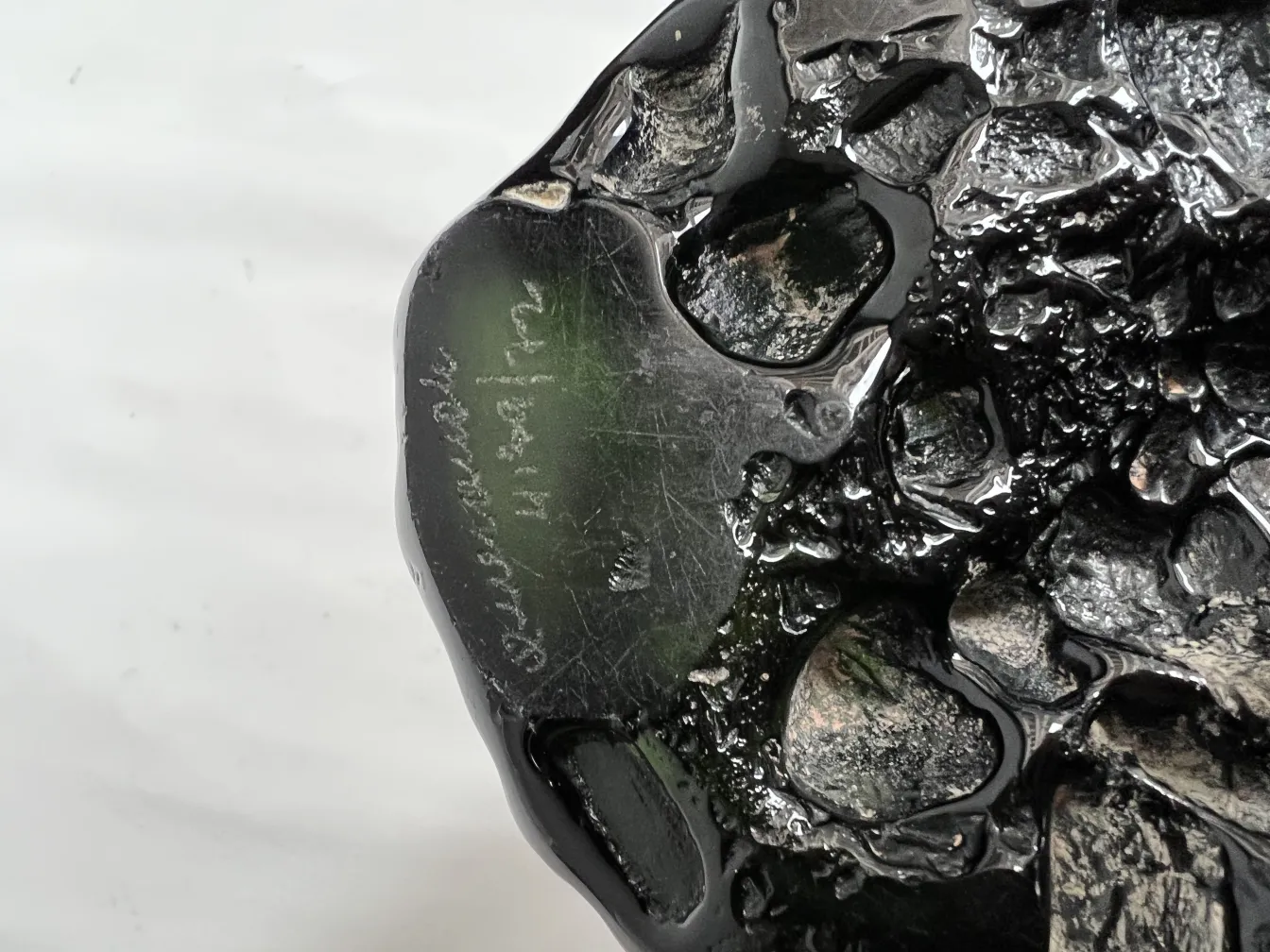 antique black vase with decorative shapes and details