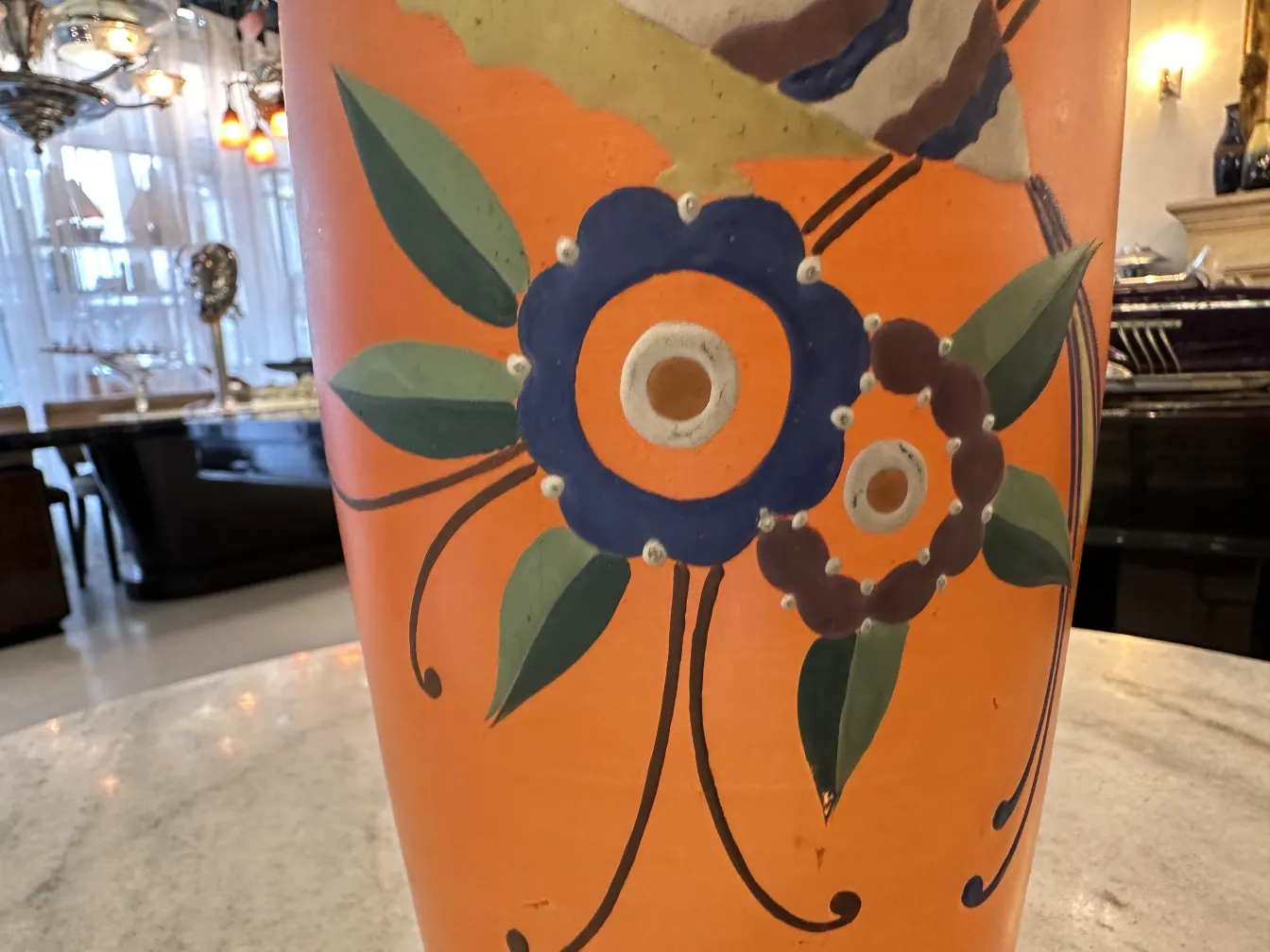 antique vase decorated with vibrant colored flowers