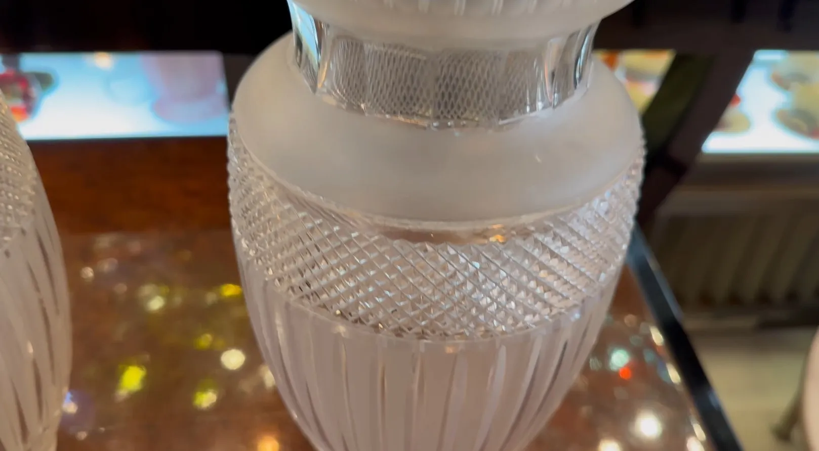 Two antique vases with decorative design on top