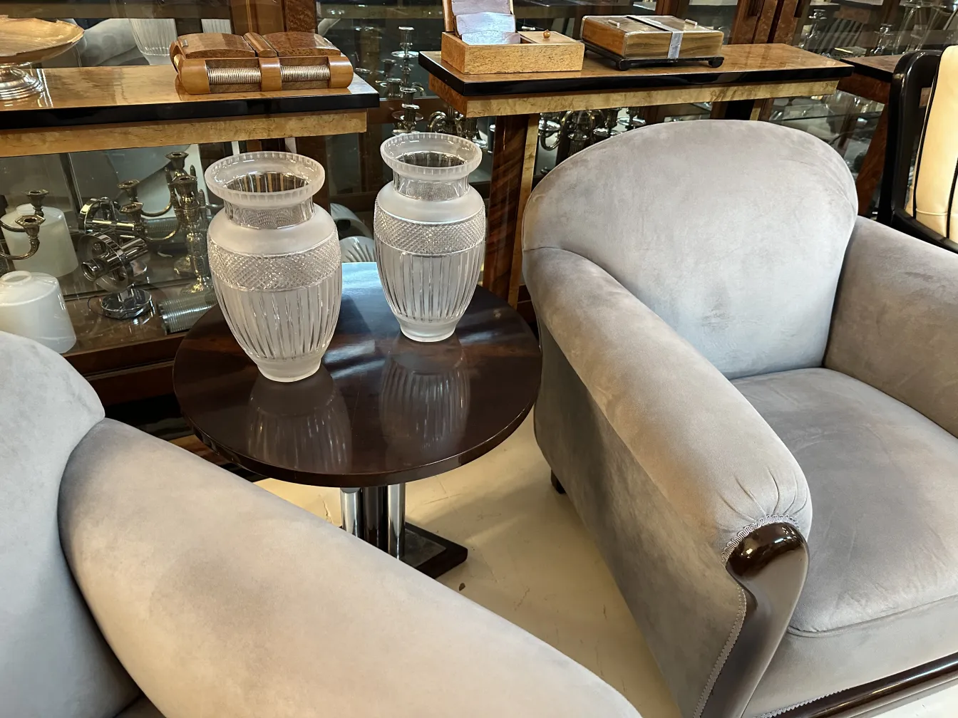 two antique vases on an elegant table, decorative background