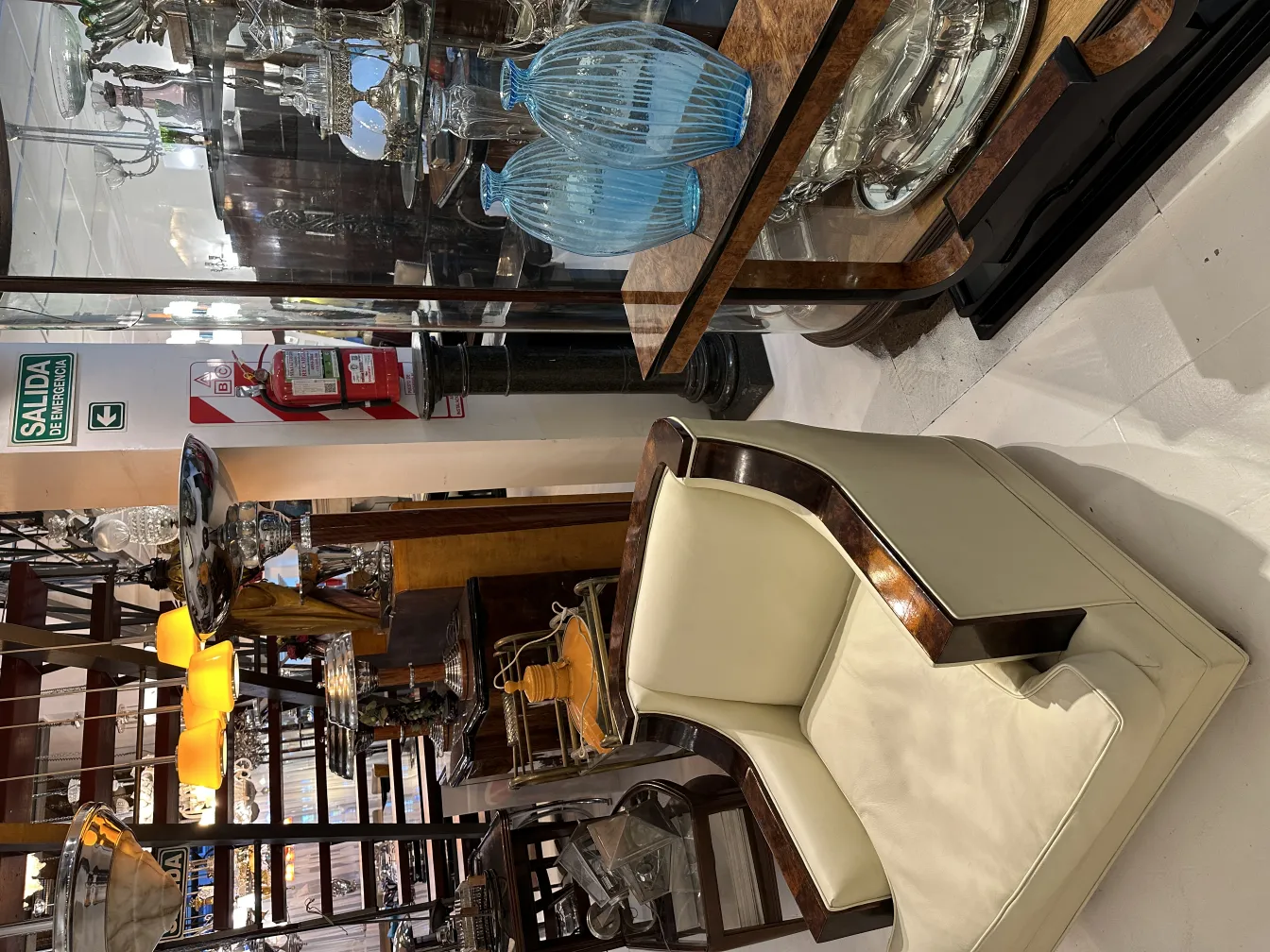 Two antique vases in a display case with shiny details, elegant setting.