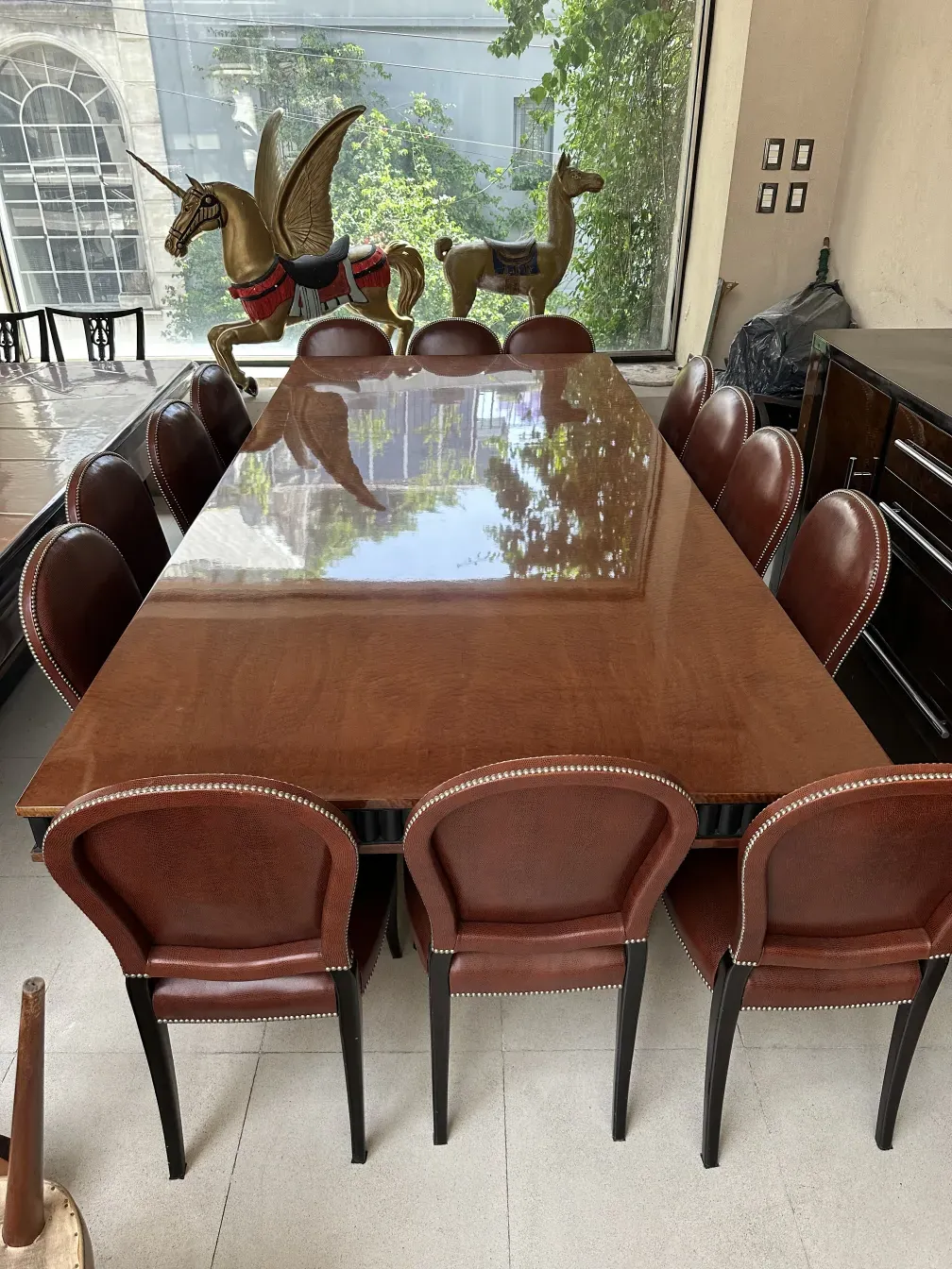 Twelve antique art deco chairs with elegant decorative details in the setting
