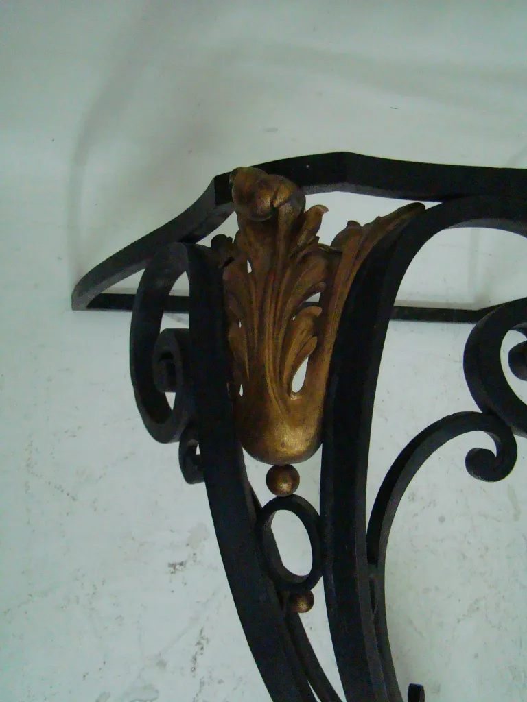 antique console edgard brant with ornate gold embellishments and elegant shape