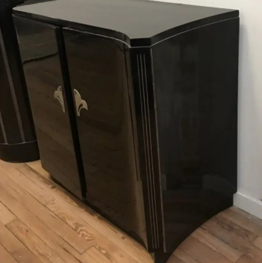 black cupboards with silver details, curved design