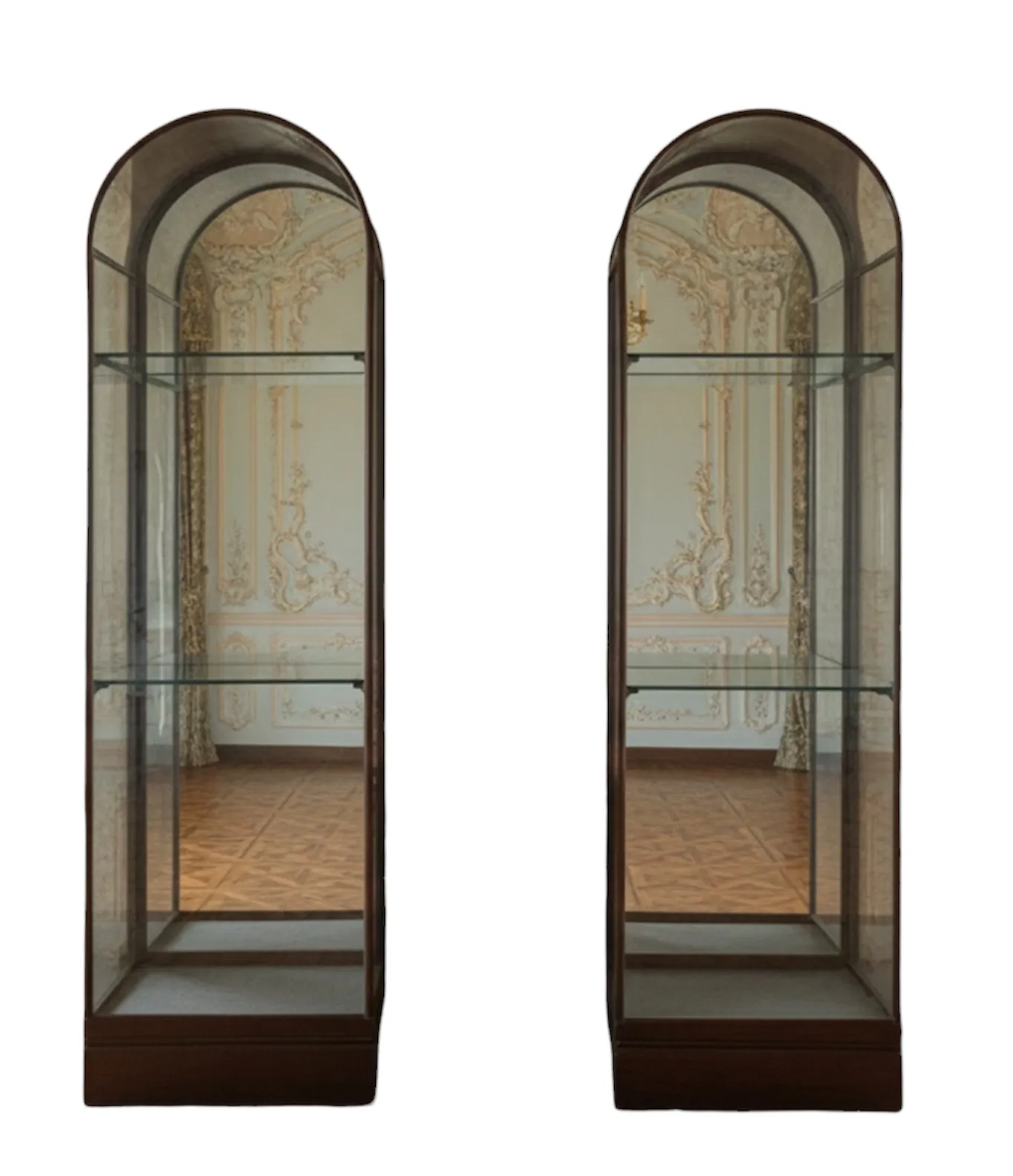 Two antique display cabinets with elegant decorative background