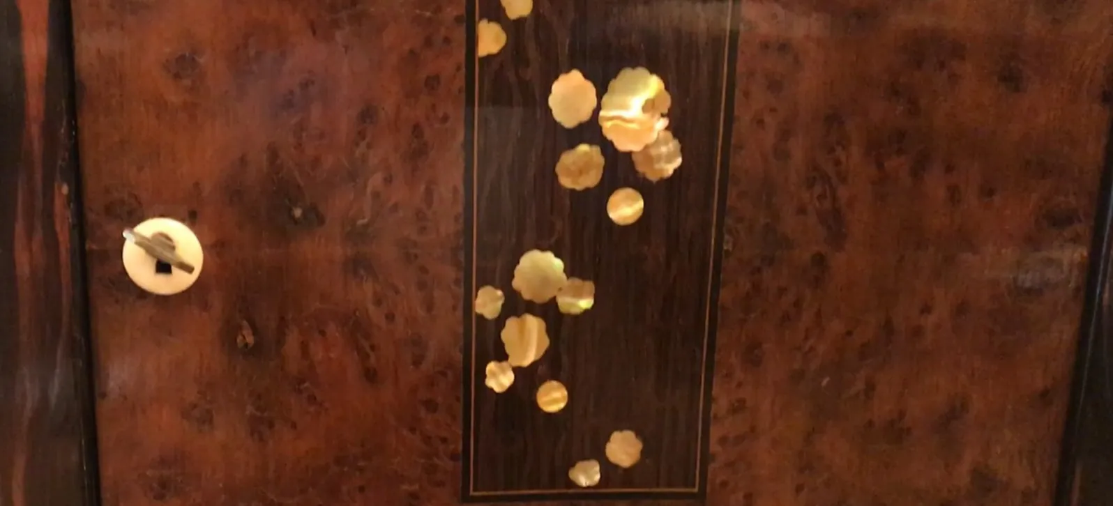 ornamental antique column with flowers and dark background