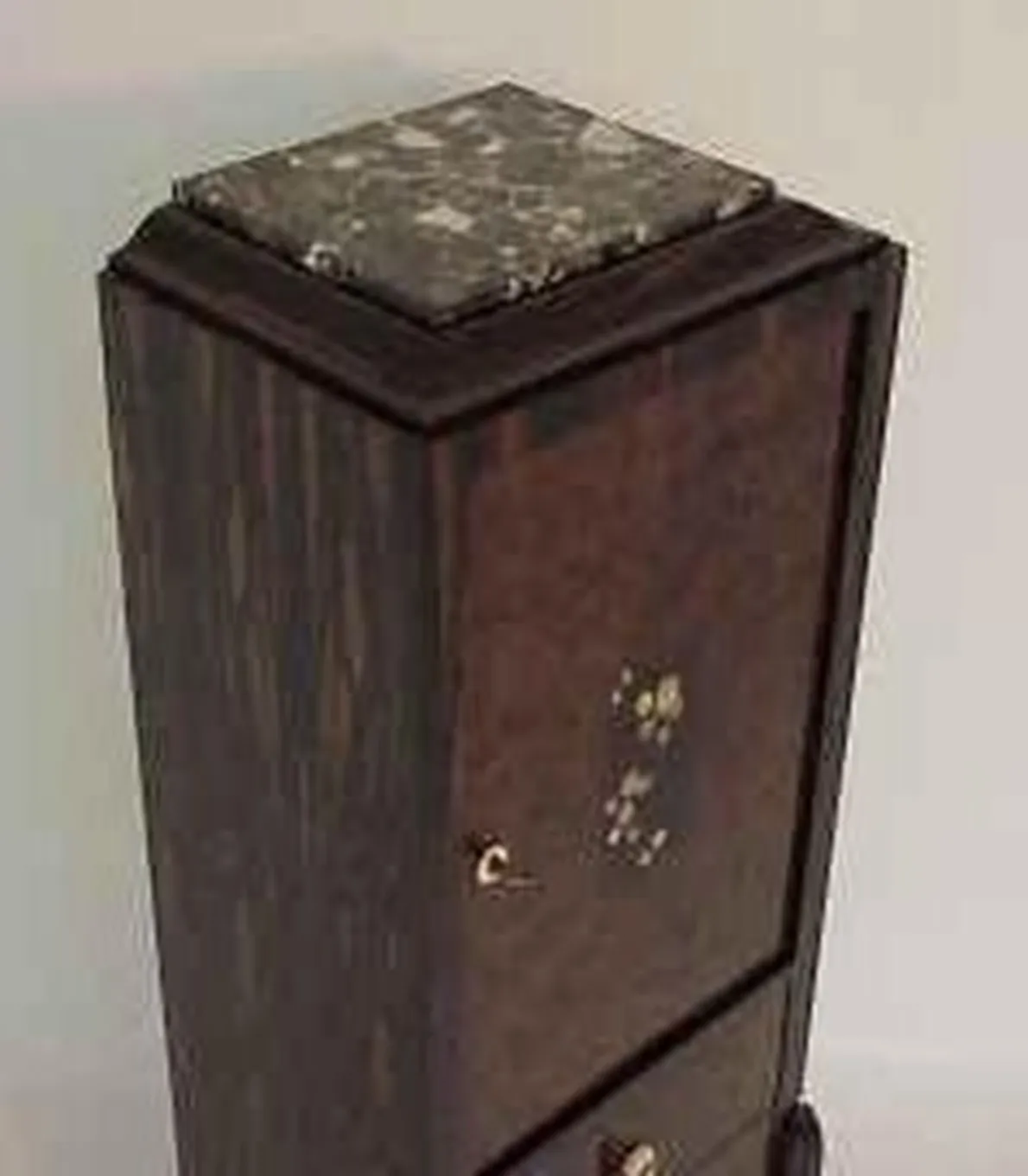 Antique column with adornments on top and detailed structure