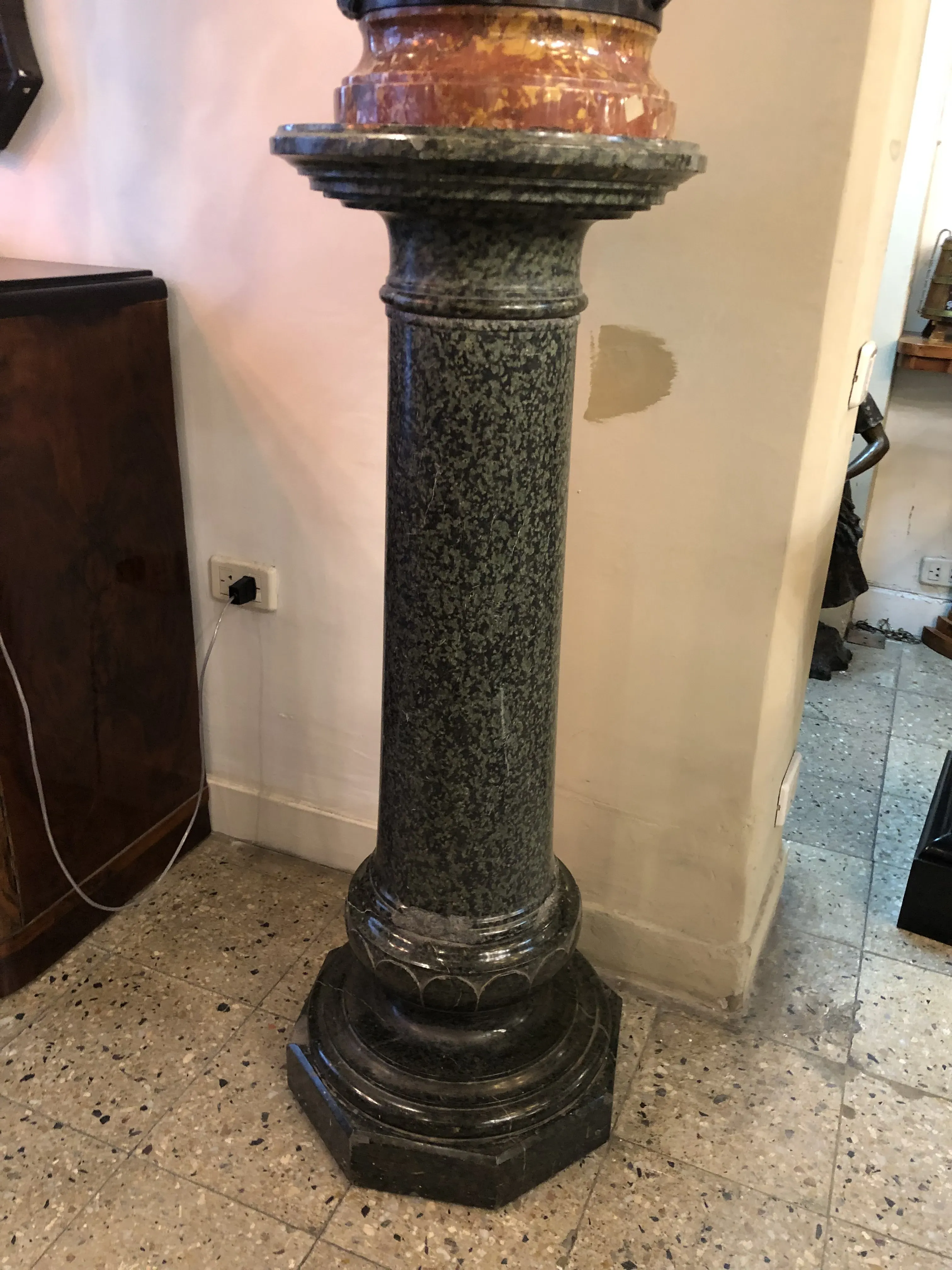 Antique decorative column with octagonal base and distinctive details