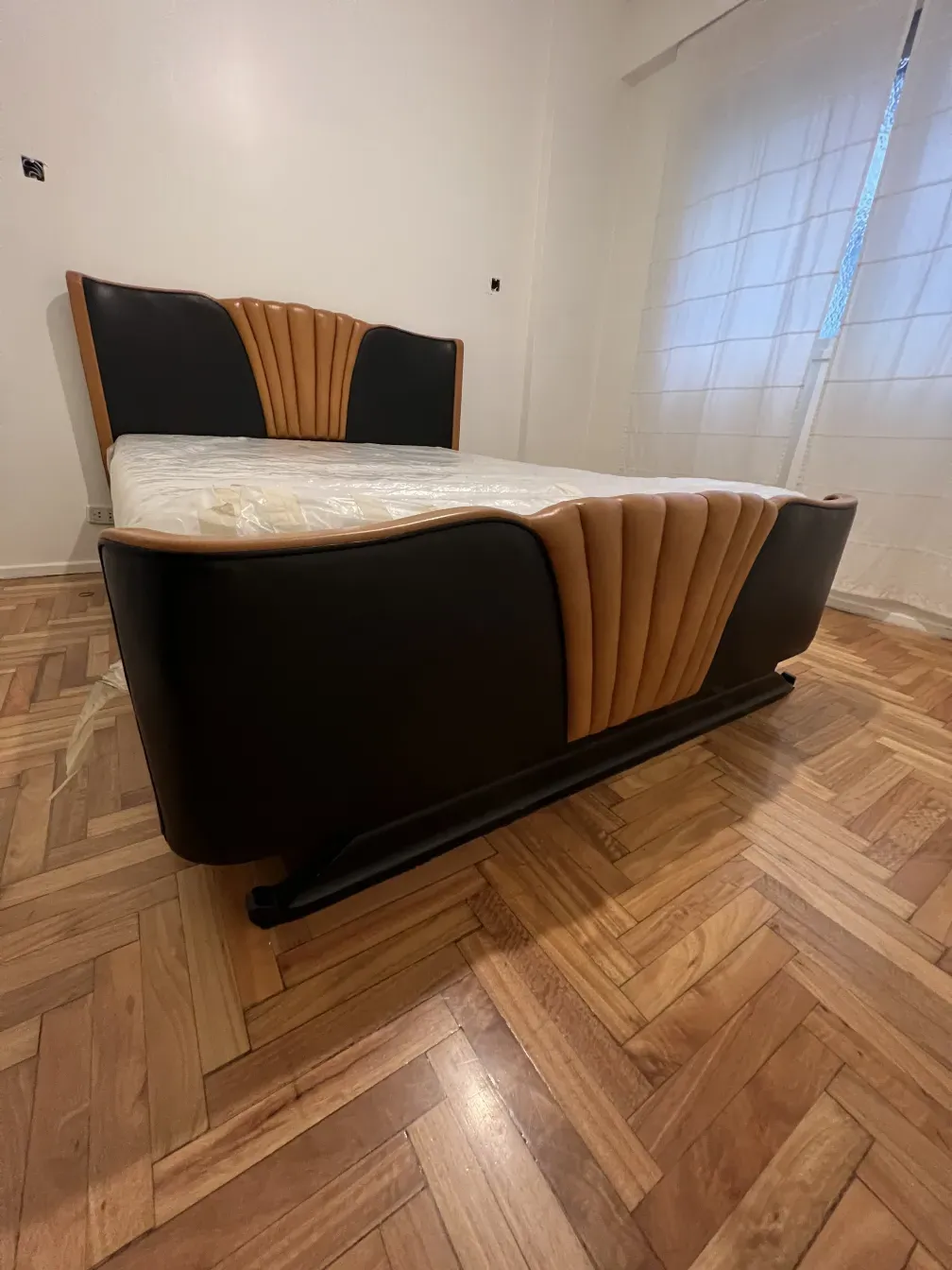 antique bed with art deco design, light background