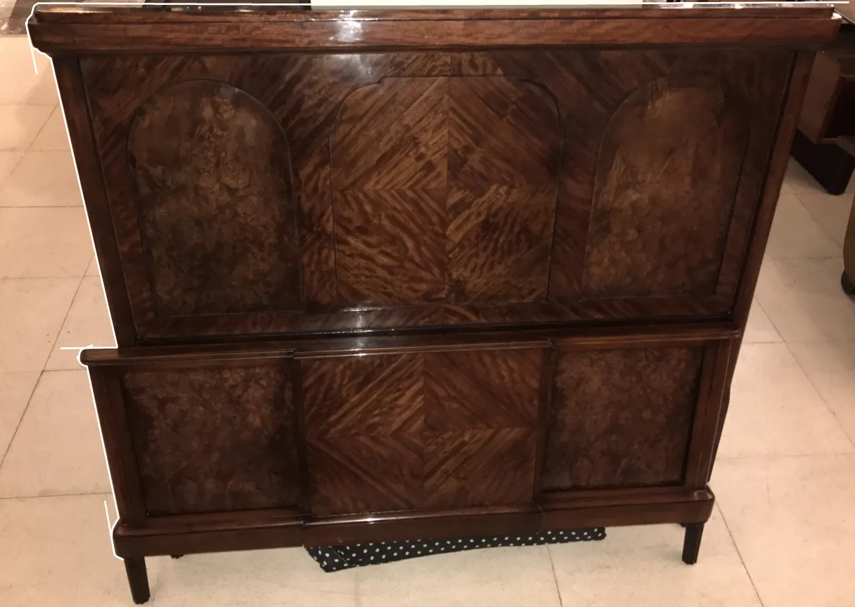 antique bed in art deco style with decorative details