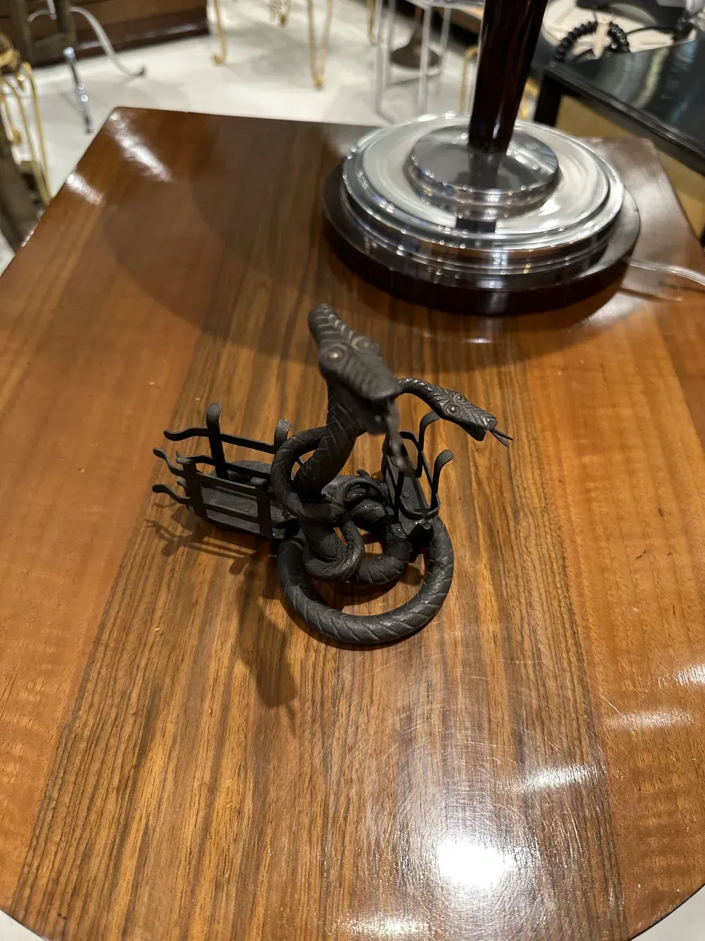 antique card tray with snake-shaped decorations on wood