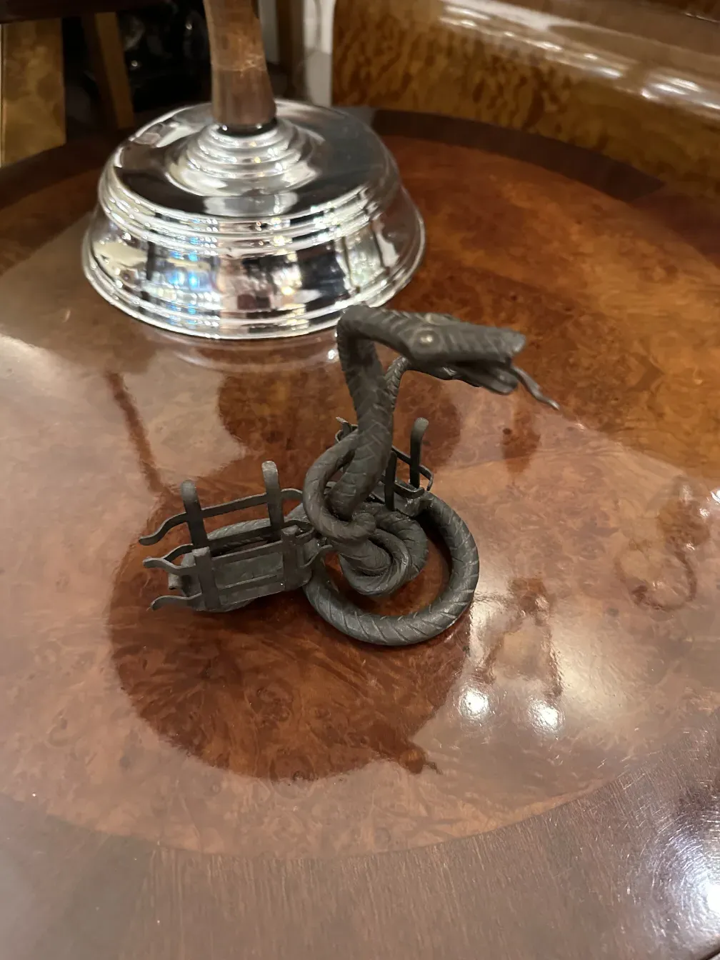 Antique card tray with dragon design, elegant and detailed, on a shiny surface.