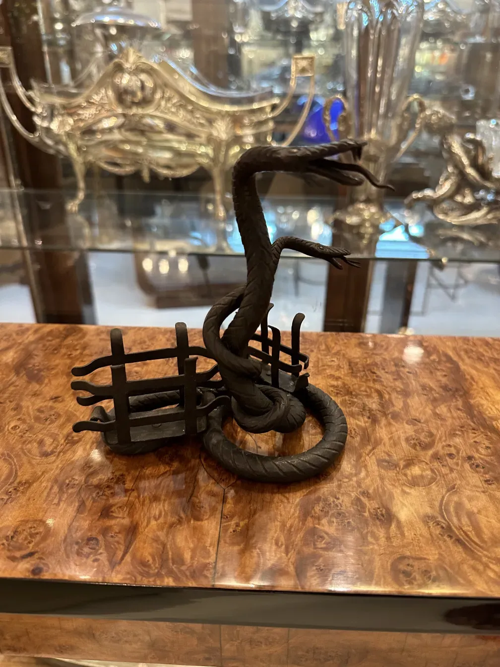 Antique card tray with snake design and background.