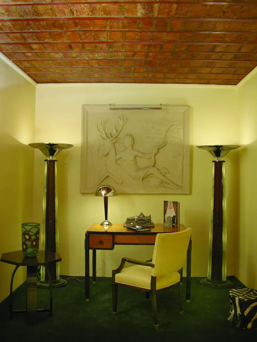 Set of antique bookends in an elegant space with soft lighting.